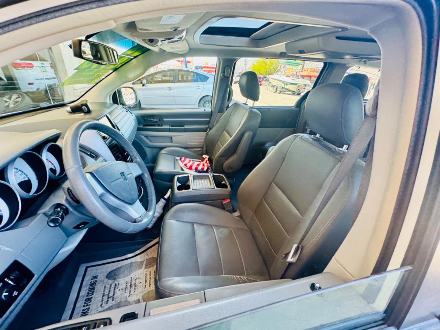 2008 White /black Dodge Caravan (2D8HN54XX8R) , located at 2190 Hwy 95, Bullhead City, AZ, 86442, (928) 704-0060, 0.000000, 0.000000 - 2008 Dodge caravan SXt. leather loaded, backup camera, bluetooth, satellite radio, rear tv,dvd player. moonroof. stow and go seating. seating for 7. rear folds down for bed. has table . free Carfax , free warranty. - Photo#5
